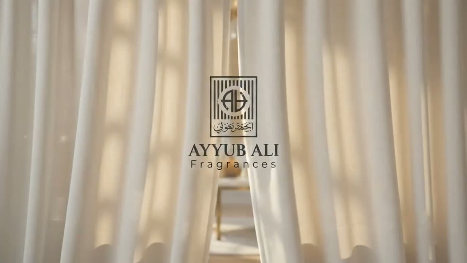An Ayyub Ali Fragrances bottle on a marble podium in a sunlit room.