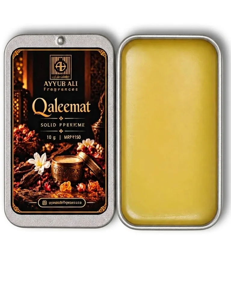 Qaleemat Solid Perfume, in its bottle.